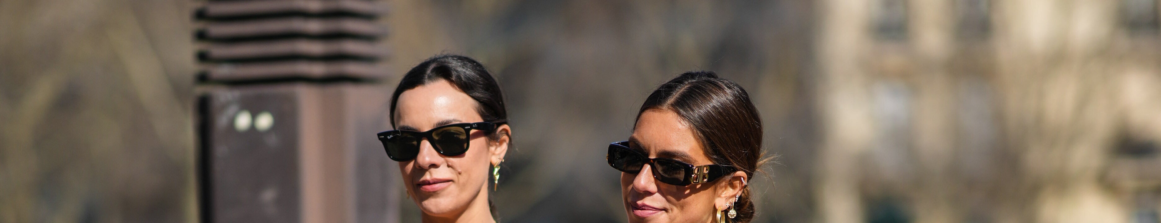 Simona Carlucci (left) and Annacarla Dall'Avo (right) wear the Miu Miu micro skirt trend during Paris Fashion Week on March 8, 2022, in Paris, France.